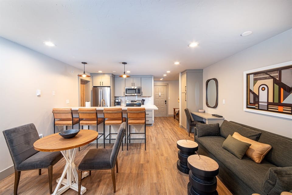 The open concept studio space seamlessly integrates living, dining & bedroom spaces | Main Level