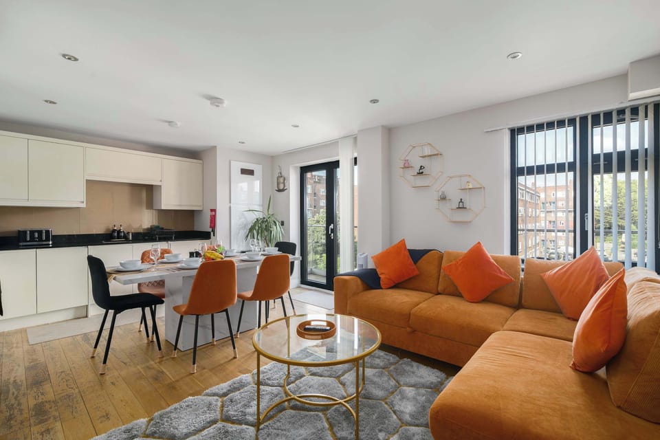 Beautifully designed open-plan living and dining area with elegant decor, creating a bright and inviting space to relax, share meals and make lasting memories together