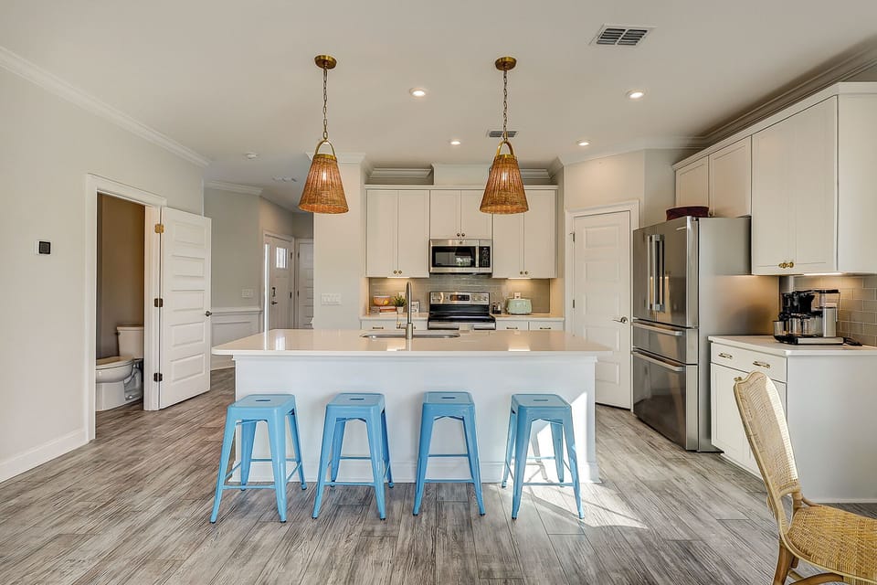 Kitchen featuring 4 barstools for extra seating