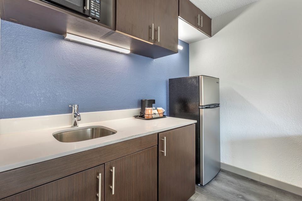 Suite, 1 King Bed | Desk, blackout drapes, iron/ironing board, free WiFi