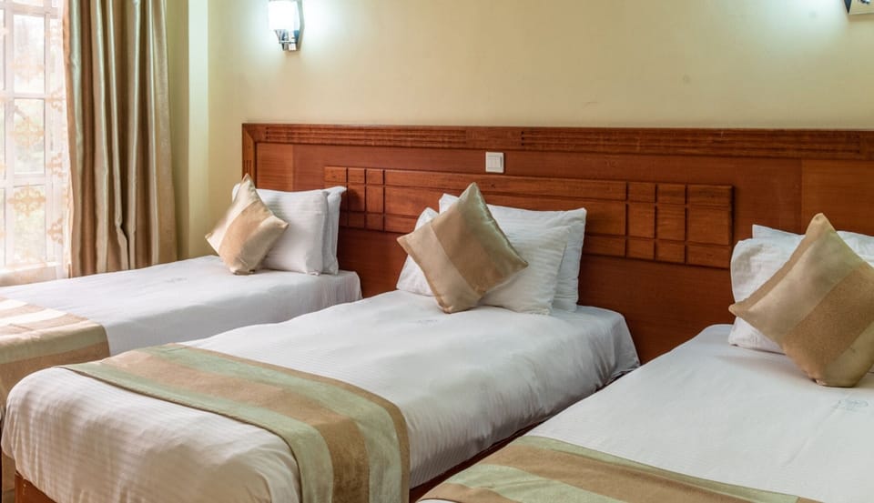 Deluxe Triple Room, Garden View | Free WiFi, bed sheets