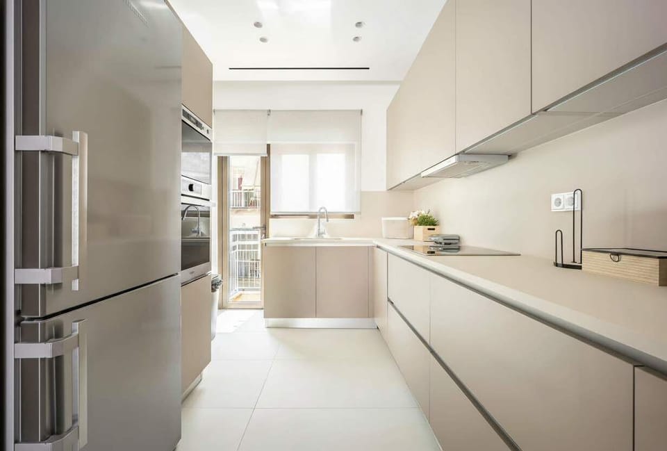 Functional kitchen with integrated appliances, appreciated for convenience and thoughtful design enhancing Athens living experience.