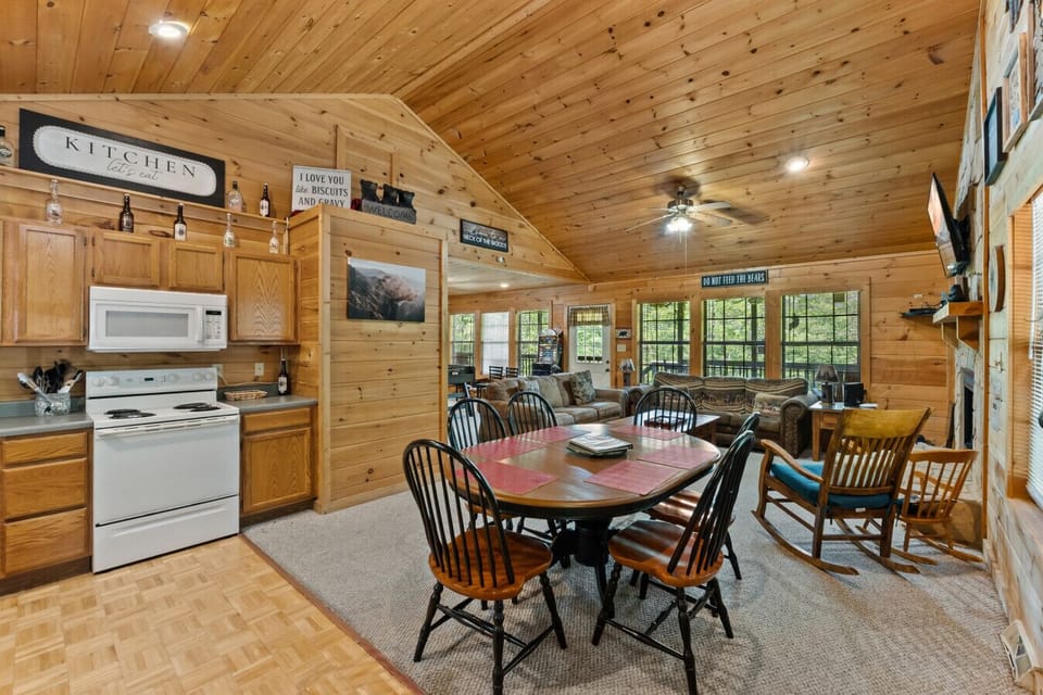 Gather around the table for a hearty breakfast or evening dinner—the open layout and high ceilings create a welcoming, spacious feel.