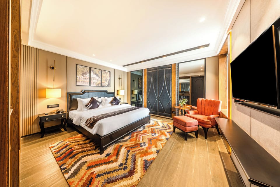 Spacious Deluxe Room with Jacuzzi | Desk, iron/ironing board, bed sheets