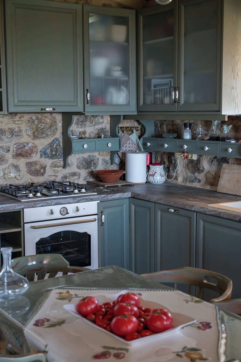 Fully equipped traditional kitchen with rustic stone walls and fresh local flavours at your fingertips