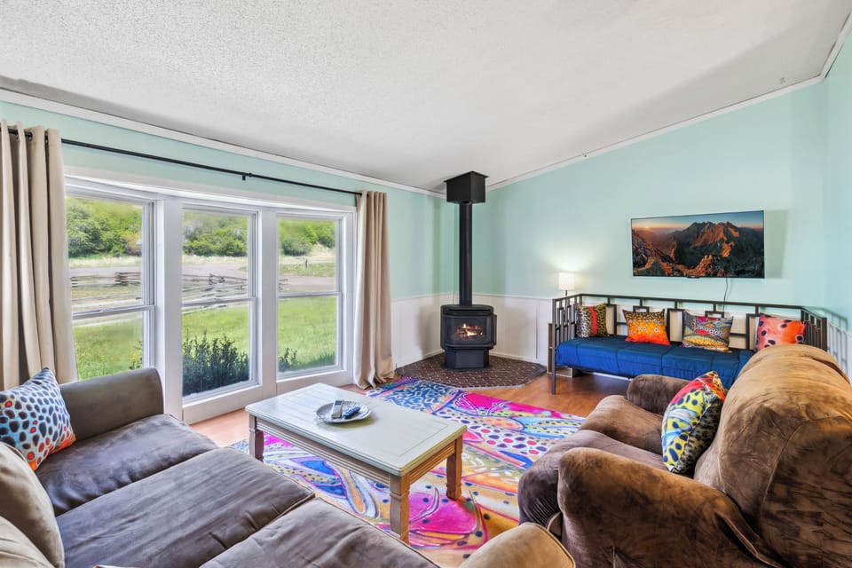Living room with gas fireplace and smart TV