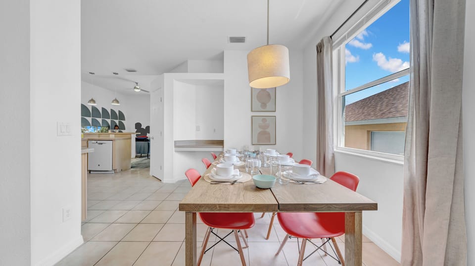 Sunny dining area wit seating for 6 (up to 8 with bench from living room).