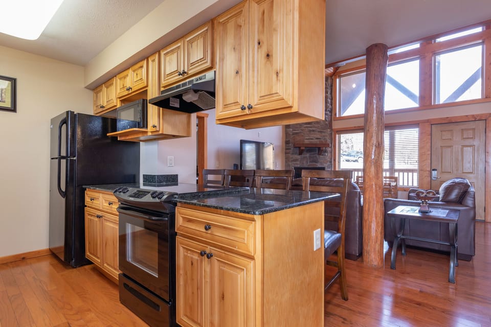 Cook up a feast in this stylish kitchen, featuring modern appliances and ample counter space, ready for family meals and memorable culinary experiences.