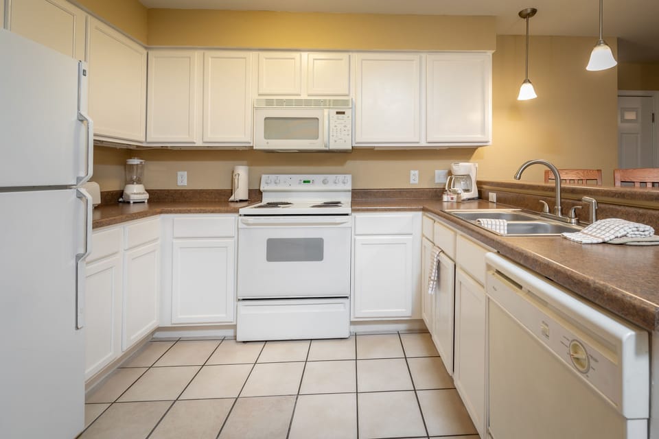 Fully equipped kitchen with modern appliances.