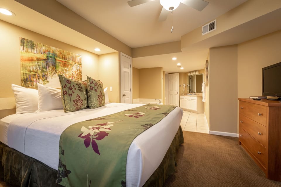 King bedroom with ensuite bathroom access and plenty of natural light