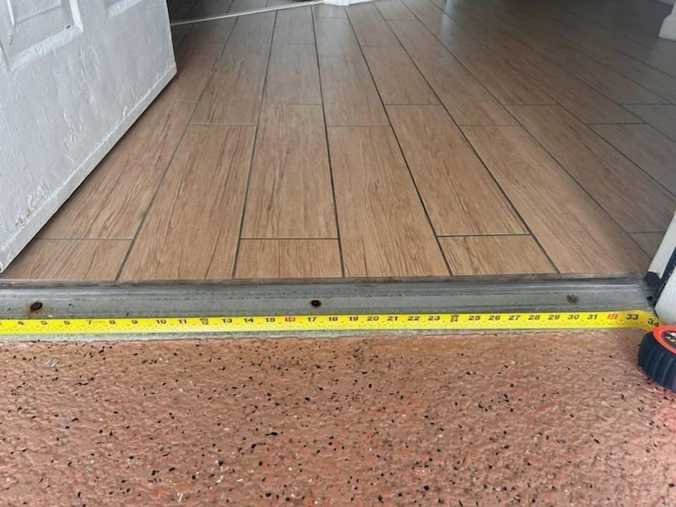 A close-up view of the threshold showcases its seamless transition, highlighting the accessible layout that enhances the family-friendly experience.
