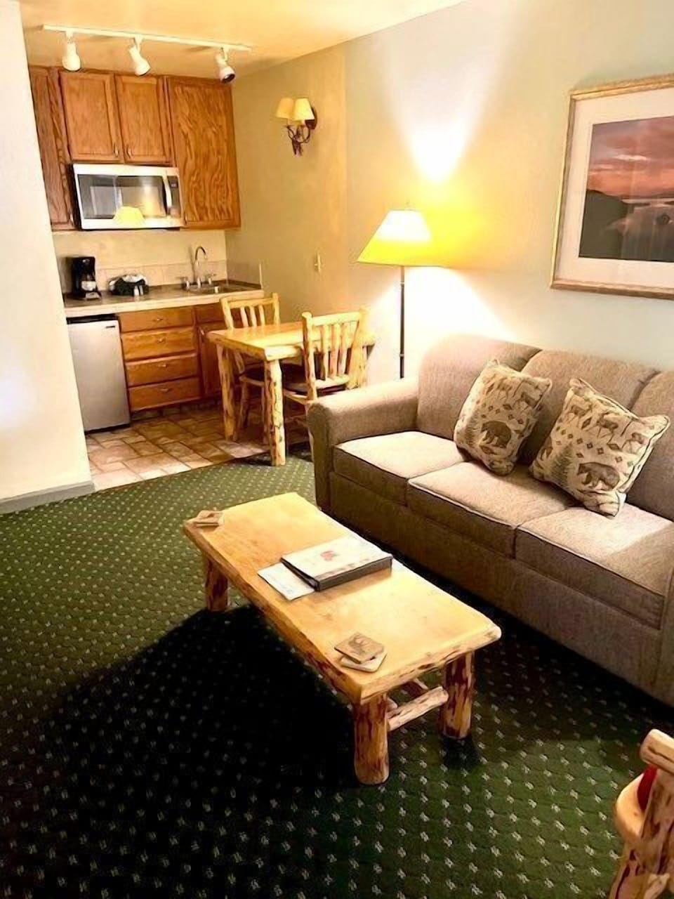 Cozy living room with kitchenette and dining area