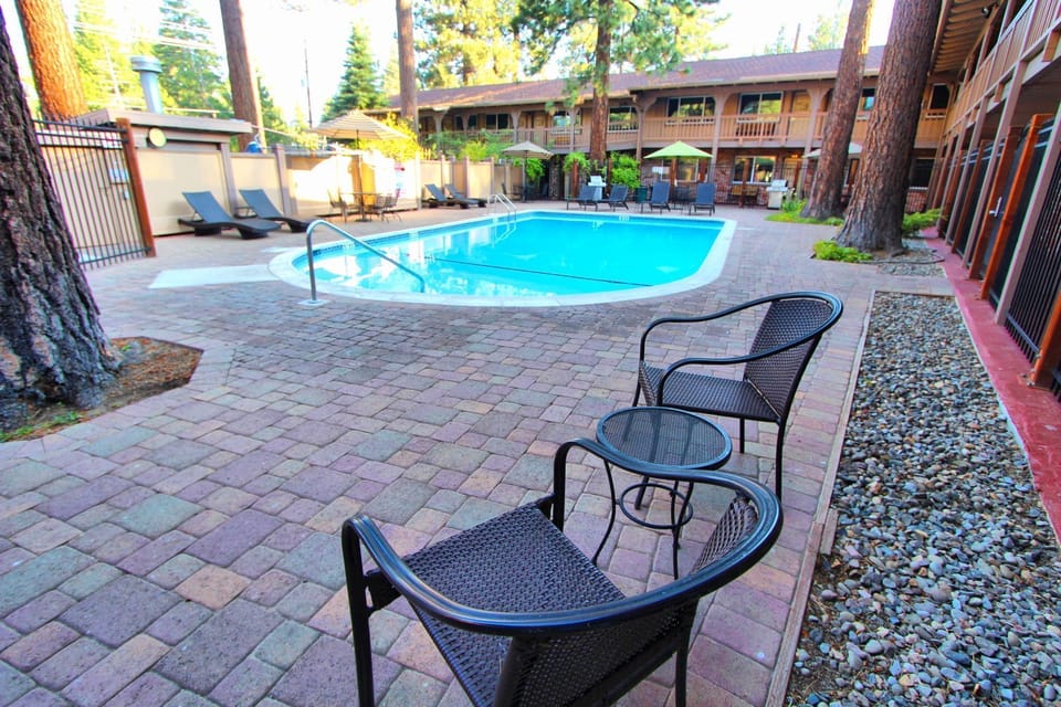 Outdoor seating beside the inviting pool area