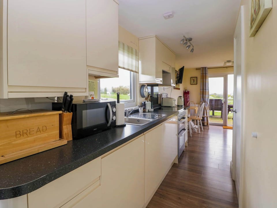 Fridge, microwave, toaster, cookware/dishes/utensils