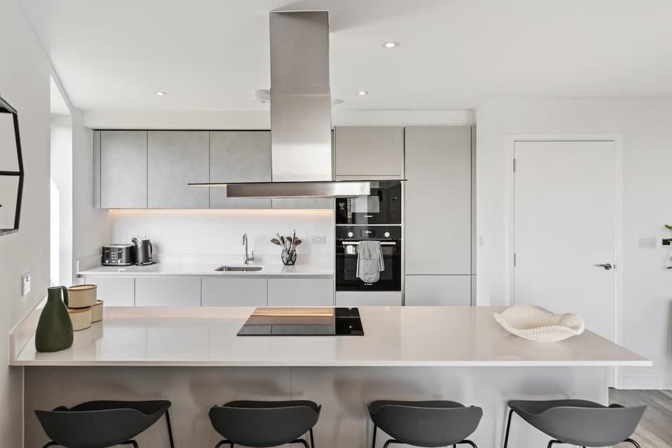 - Spacious modern kitchen with sleek appliances and storage  
- Large island with bar seating ideal for casual dining  
- Airbnb setup blending functionality and stylish design  
