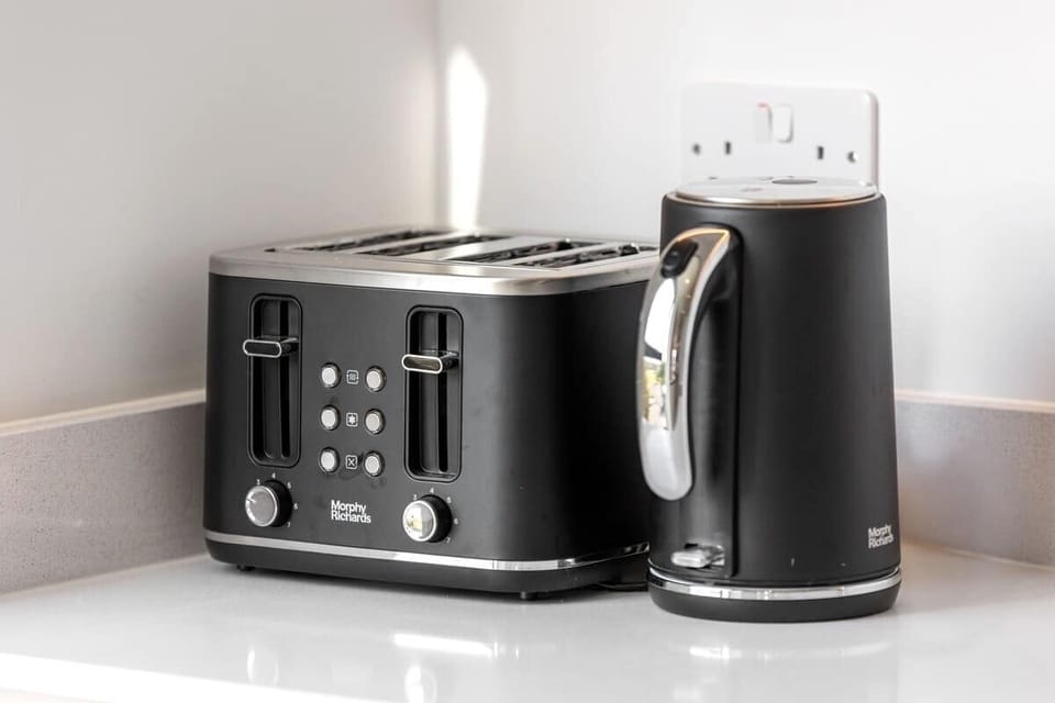 - Modern kitchen appliances with sleek kettle and toaster set  
- Functional Airbnb amenities for easy breakfast preparation  
- Perfect details for comfort and convenience during your stay  
