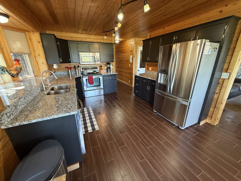 Full kitchen with new counter tops and cabinets for your cooking needs