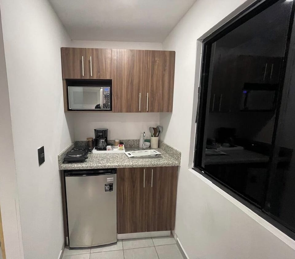 Comfort Quadruple Room | Private kitchen | Mini-fridge, microwave