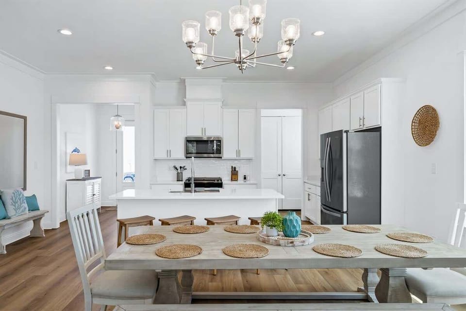 Dining Room: Large, accommodating dining room that comfortably seats 10. This open concept dining room is bright and airy with nature views.