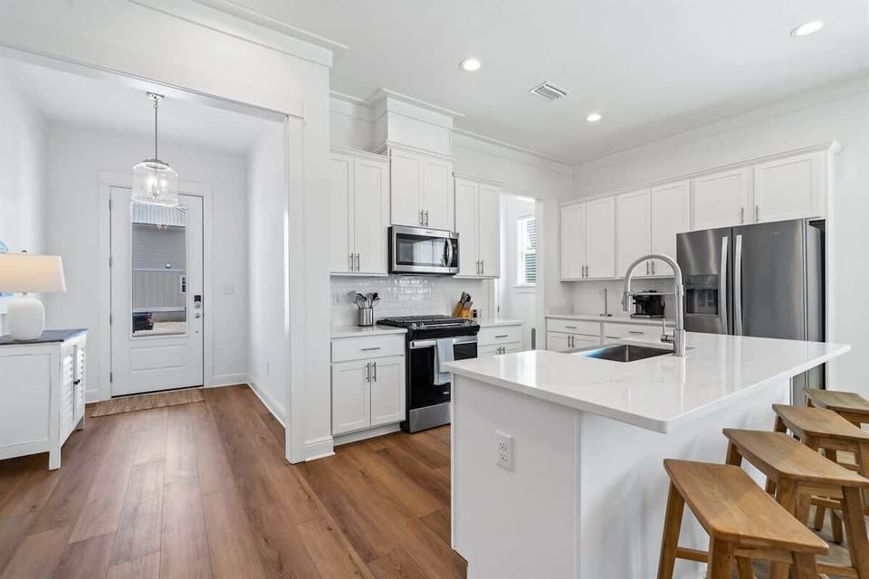 Entry way and open concept kitchen: The large, spacious entry-way is bright, airy, with open access to a large, well-equipped gourmet kitchen. Additional bar seating is adjacent to the large, inviting, dining room table. Seats 14.