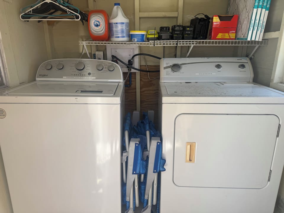 Full size washer/dryer located in shed behind house