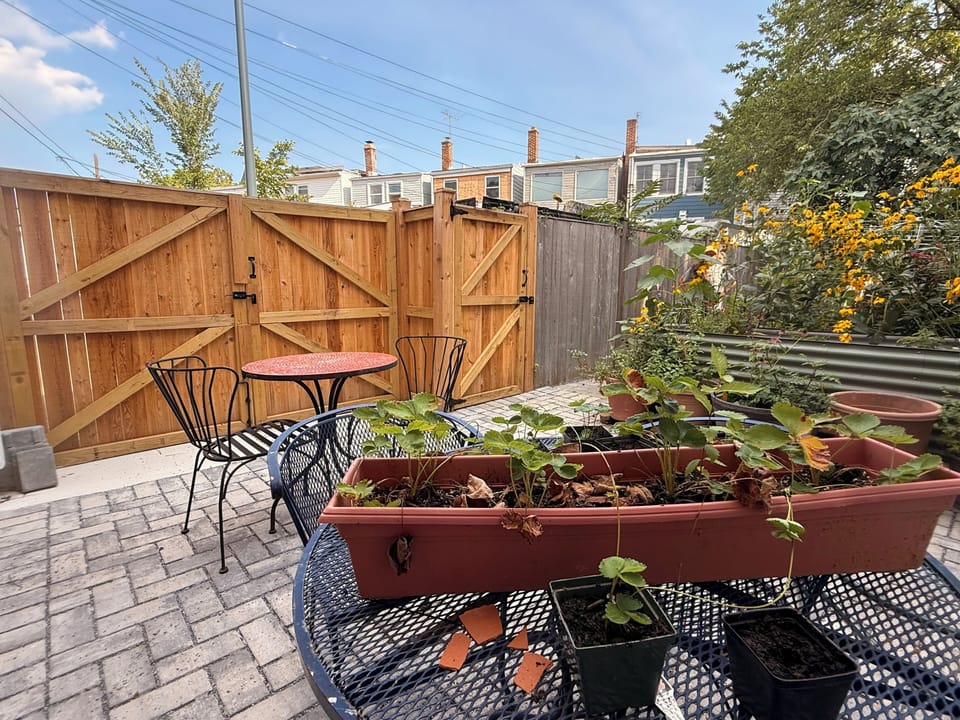 Enjoy a sunny patio (if you are not parking there)