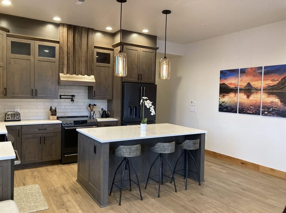 With custom features & beautiful artwork throughout, this chic downtown Whitefish condo is a great spot for your next Montana adventure | Main Level