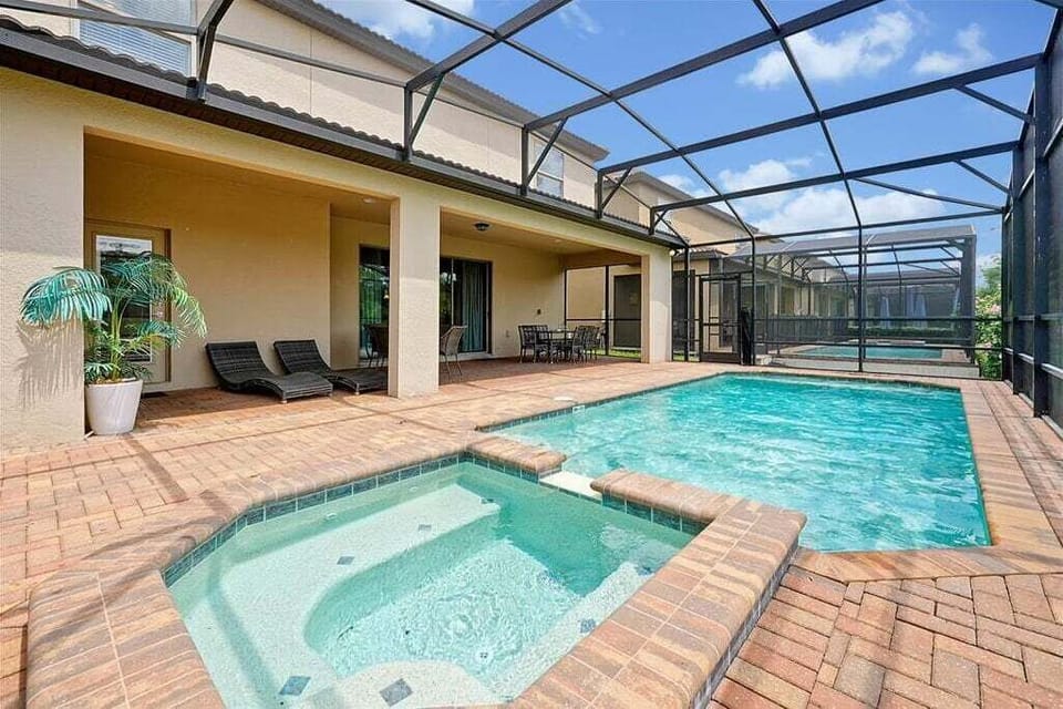 Soak up the Florida sun in your screened-in private pool and spa
