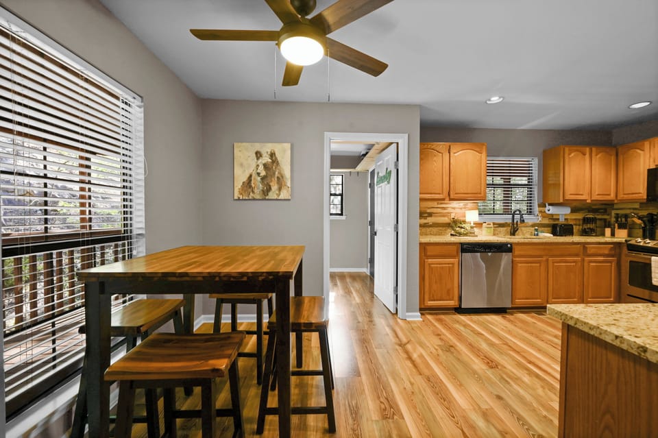 A kitchen table, sits an additional 4 people.