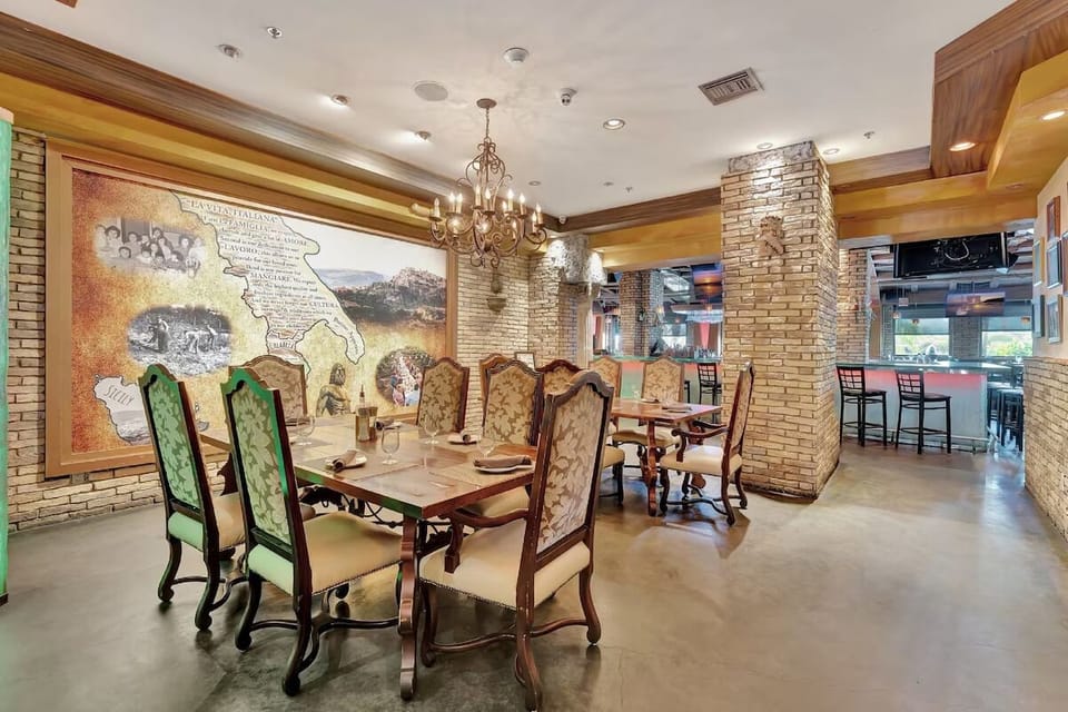 Dine together in a cozy room with rustic stone accents.