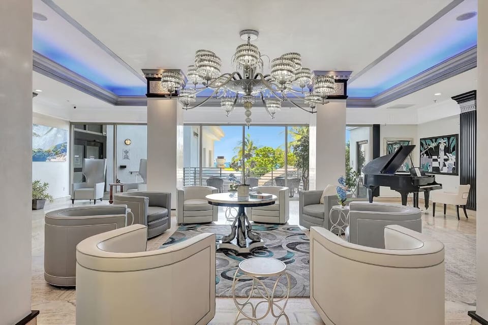 Unwind beneath glittering chandeliers in this elegant, airy lobby.