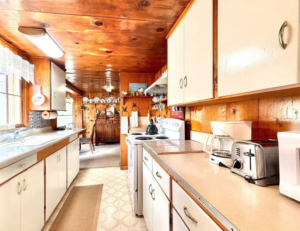 Galley kitchen with all the cooking essentials you'd need for cooking a meal with your family.