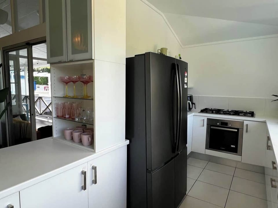 Fully equipped with everything but the chef - gas cooktop, electric oven, microwave, dishwasher, fridge/freezer, an air fryer, Nutribullet and a Nespresso machine for your morning caffeine fix.