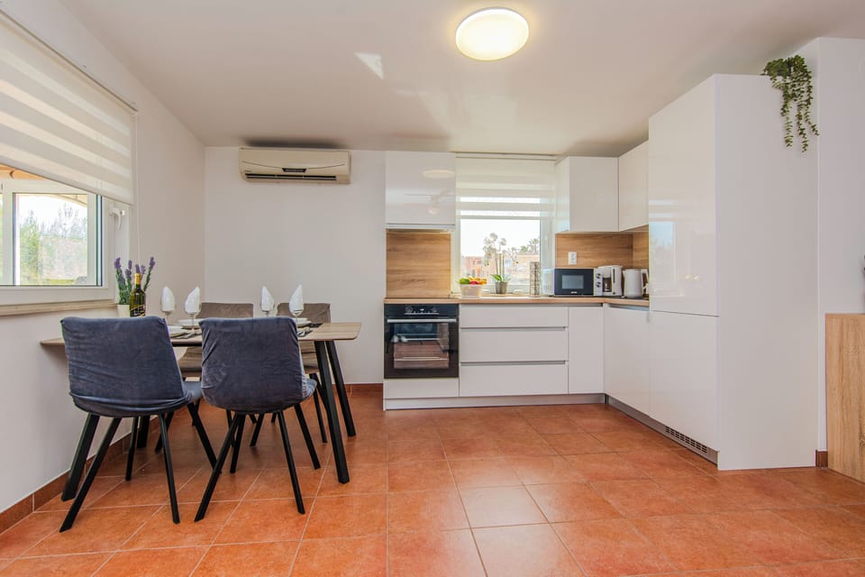 Standard Apartment, Balcony, Partial Sea View | Private kitchen | Full-size fridge, microwave, oven, stovetop