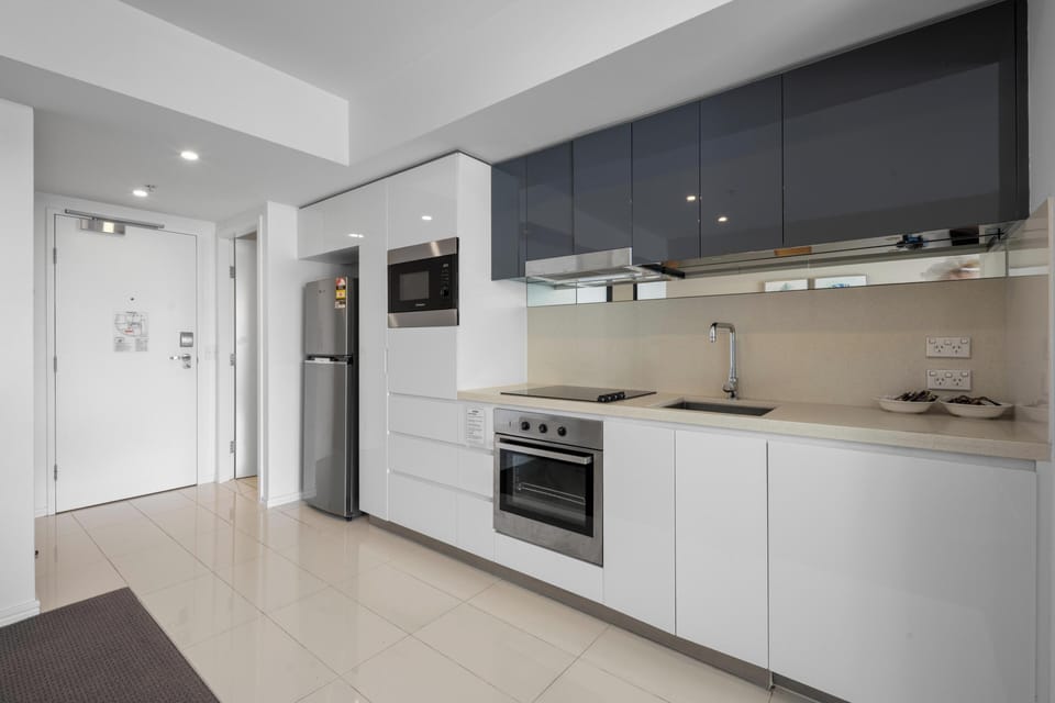Modern kitchen with sleek appliances and ample counter space.