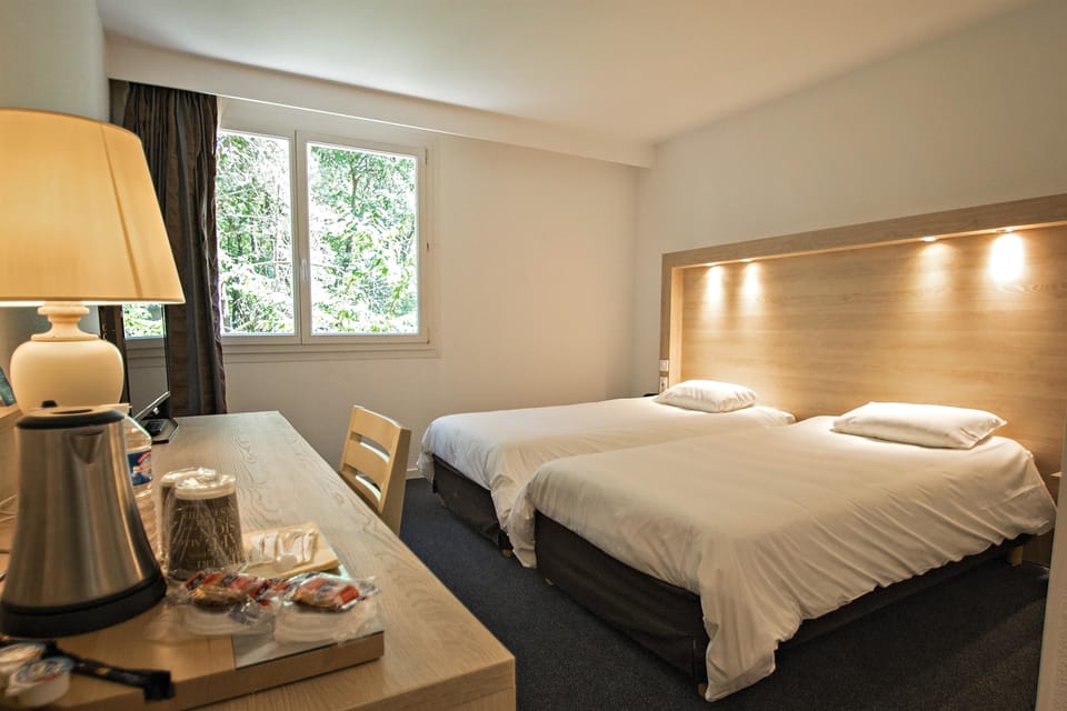 Premium bedding, desk, blackout drapes, soundproofing