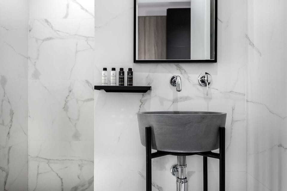Elegant marble vanity area offers a refined space for smooth morning routines.