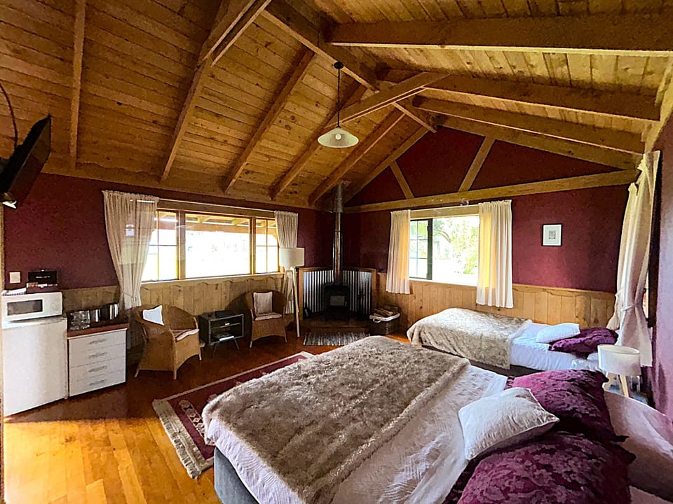 Chalet, 1 Bedroom, Fireplace, River View | Living area | 32-inch Smart TV with satellite channels, Netflix, streaming services
