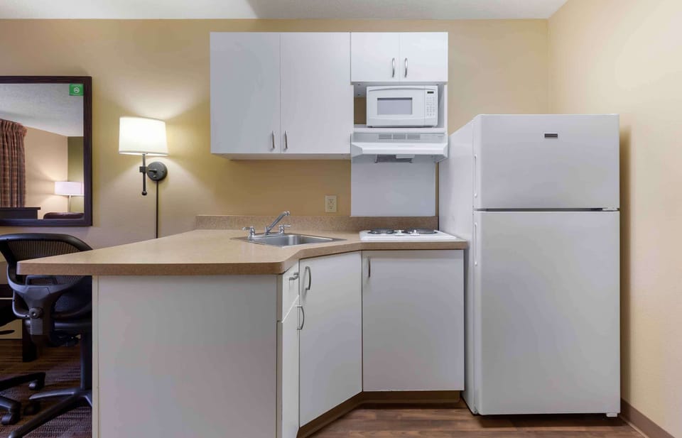 Studio, 1 Queen Bed, Non Smoking | Private kitchen | Full-size fridge, microwave, stovetop, coffee/tea maker