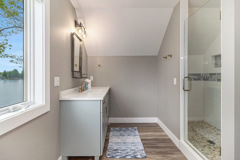Main Bathroom - Main Bathroom located off of Main Bedroom with His/Hers Sink and Vanities, Free Standing Bath Tub and Step in Tile Shower with Glass Door.