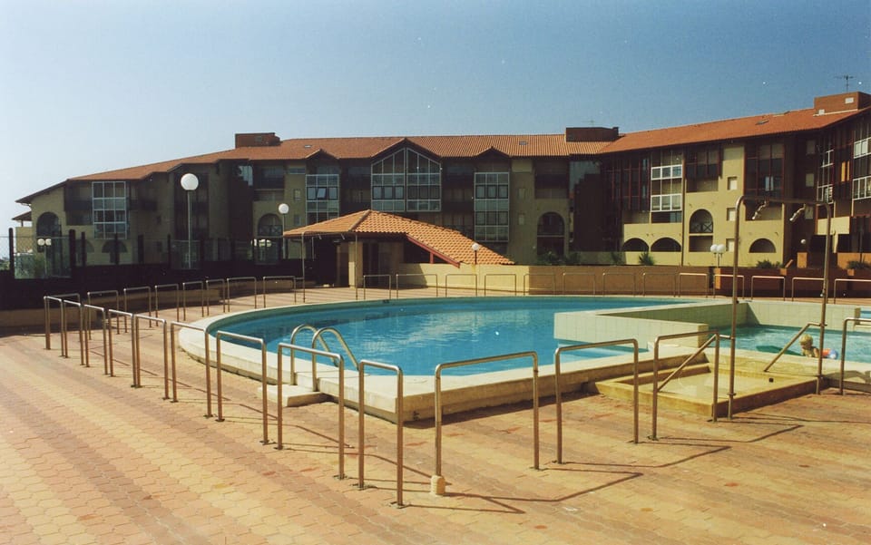 apartments' shared pool with paddling pool