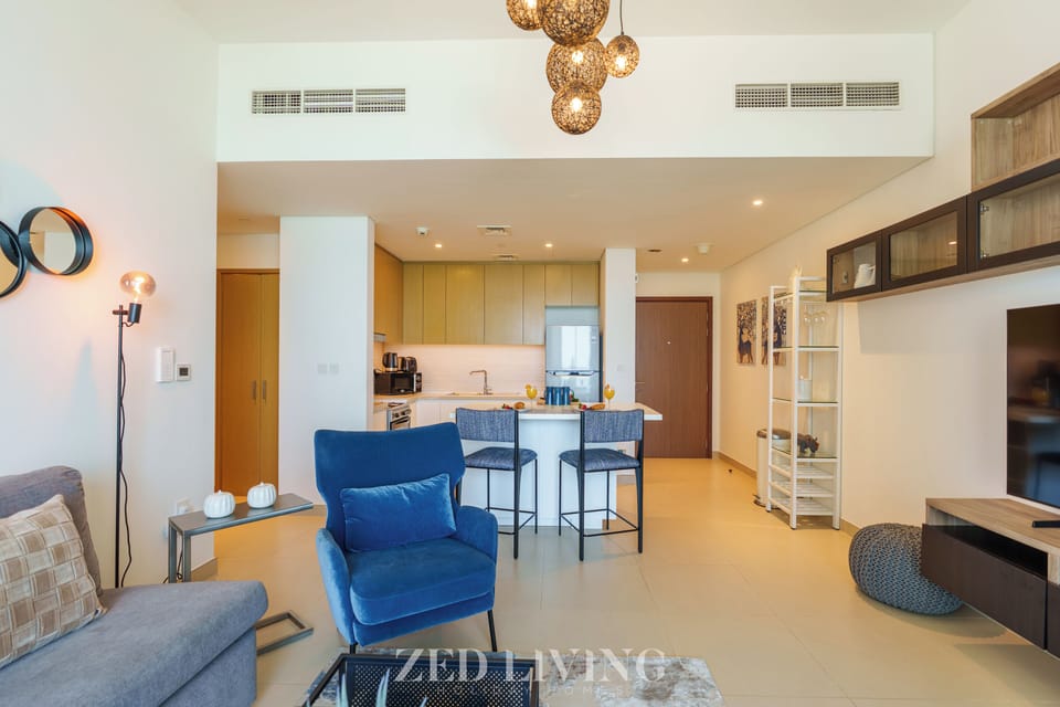 Deluxe Apartment, Sea View | Living area | 55-inch Smart TV with satellite channels