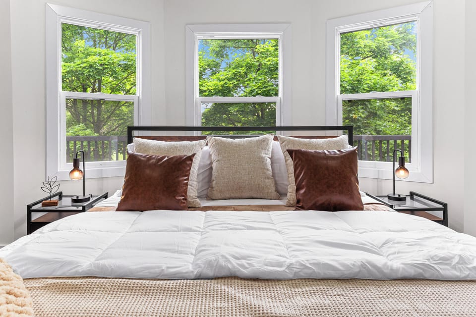 Bedroom 1 with plush beddings and pillows