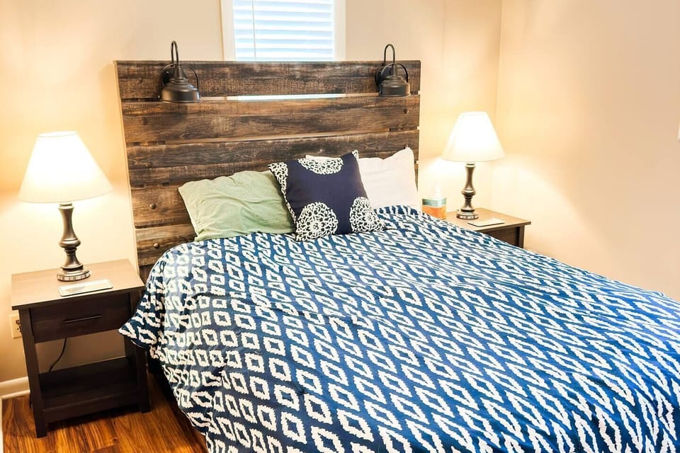 Spacious Queen featuring premium linens and a quiet wooded outlook.