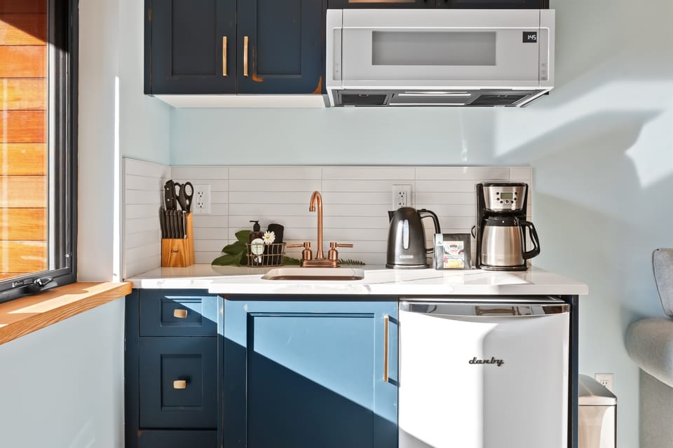 mini fridge, coffee maker, kettle, microwave