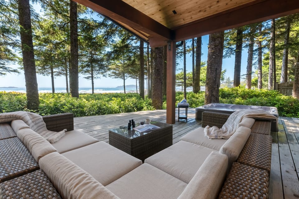 Large seating area with a hot tub on the beach!
