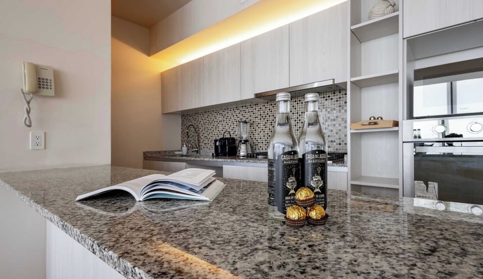 Spacious kitchen island w/ cooktop & bar seating, ideal for casual meals or conversation