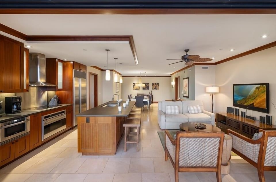 Seamless flow between the living, kitchen and dining areas in this humble abode.