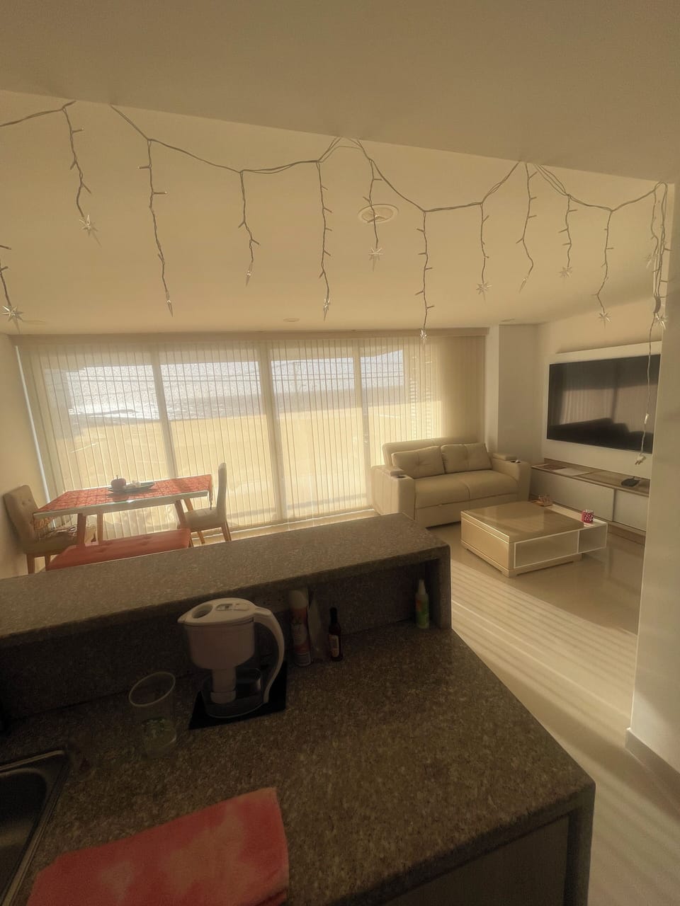 Dining room, living room, kitchen, 2 large sofas and 2 large futons on balcony.