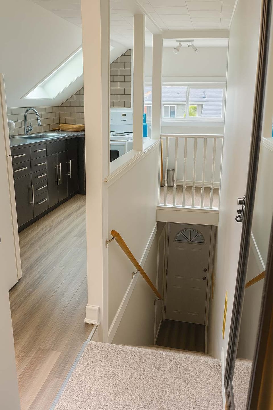 Kitchen + Staircase to Entrance